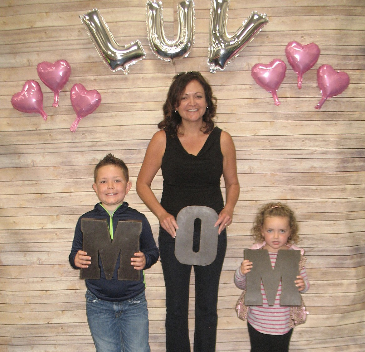 Courtesy photo
Moms and kids, grandmas and brothers and sisters, posed for pictures at the photo booth at &#145;Muffins with Mom&#146; at Peninsula Elementary Thursday.