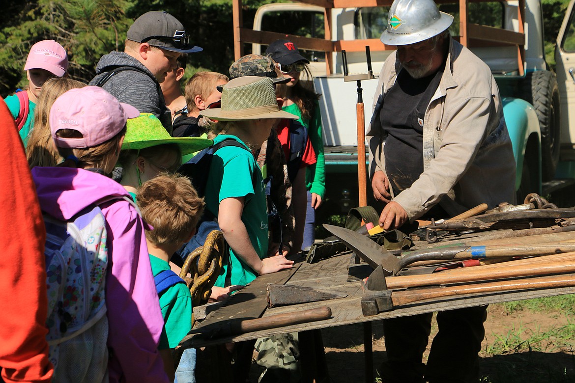 (Photo by MARY MALONE)
Novice groups, such as these students from Farmin-Stidwell Elementary and the Careywood 4-H club, learned all about forestry, including the tools used, during the 35th annual Idaho State Forestry Contest Thursday at the Delay Tree Farm in Careywood, in which more than 550 Idaho youth participated.