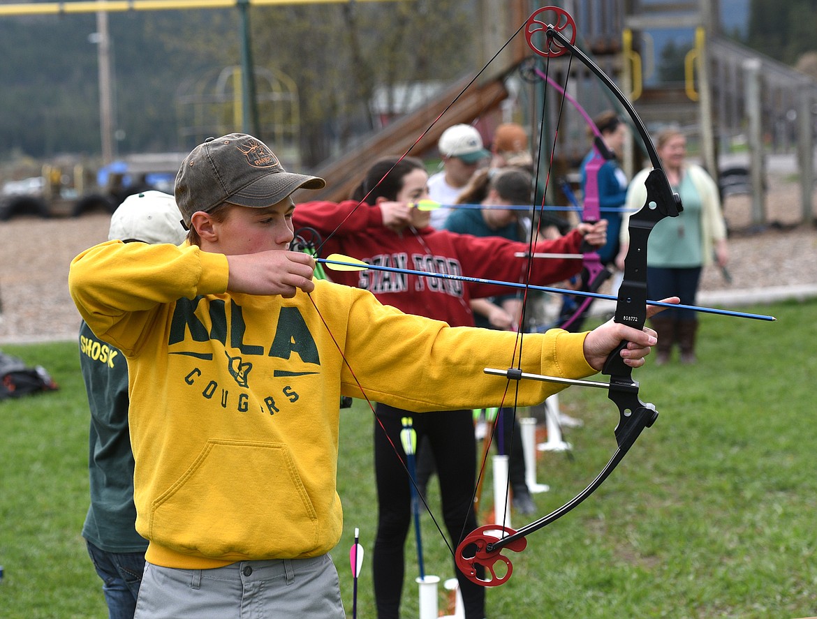 Kila eighth-grader Morgan Hulford aims his arrow during an archery class at the school on Tuesday. (Aaric Bryan photos/Daily Inter Lake)