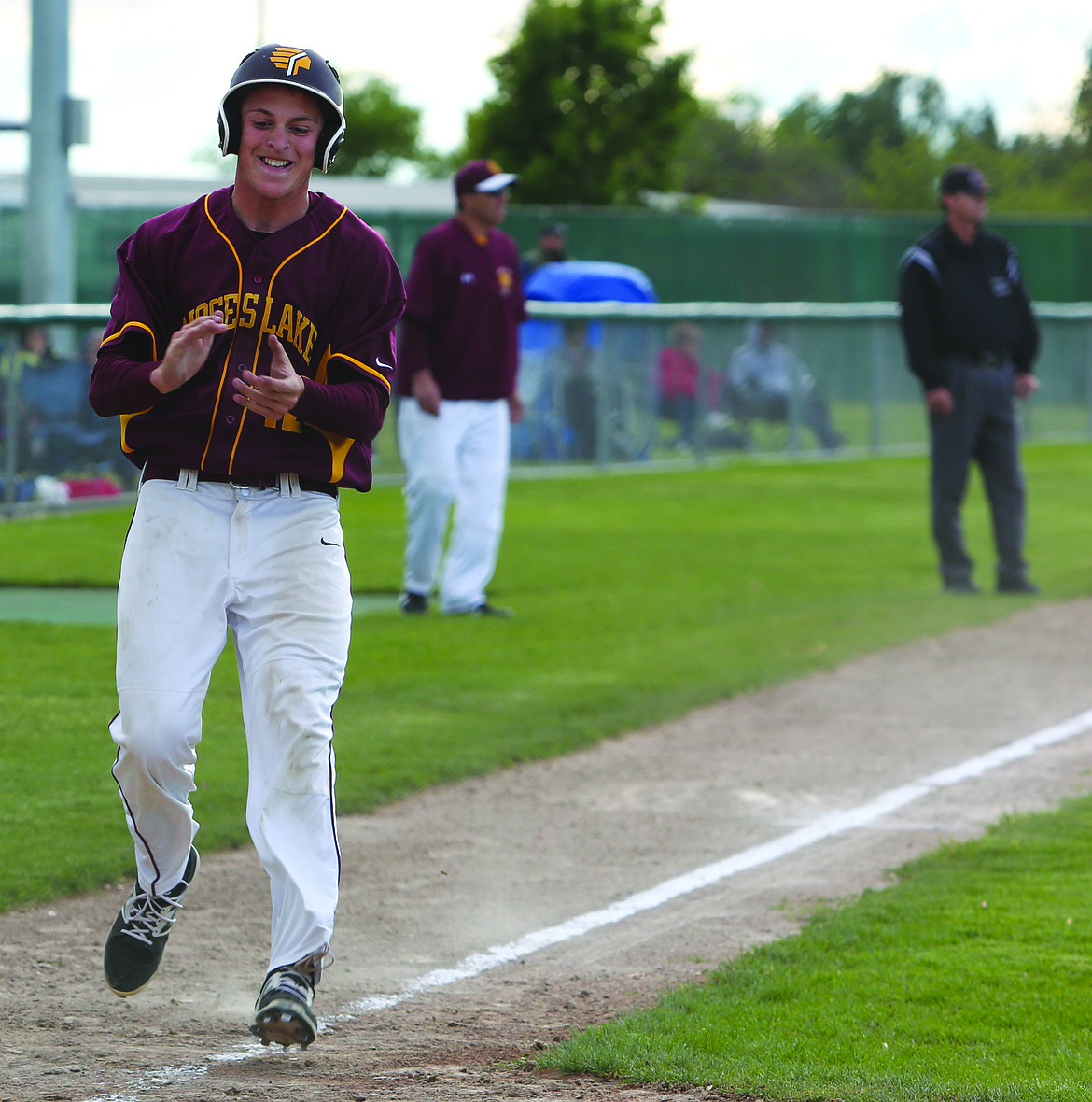 Connor Vanderweyst/Columbia Basin Herald
Moses Lake senior captain Cameron Duke comes into score in the sixth inning against Eastmont.