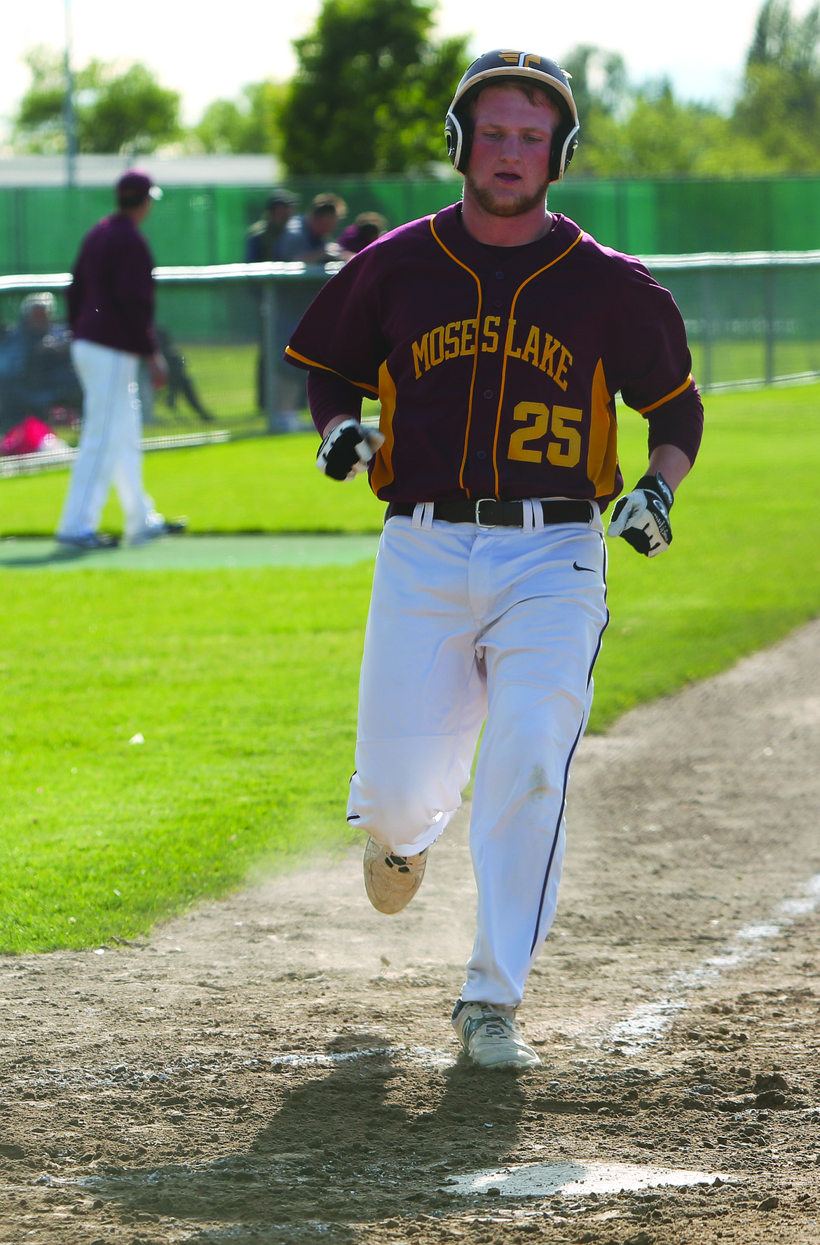 Connor Vanderweyst/Columbia Basin Herald
Moses Lake's Brandon Swett scores after an RBI double by Cameron Duke in the third inning against Eastmont.