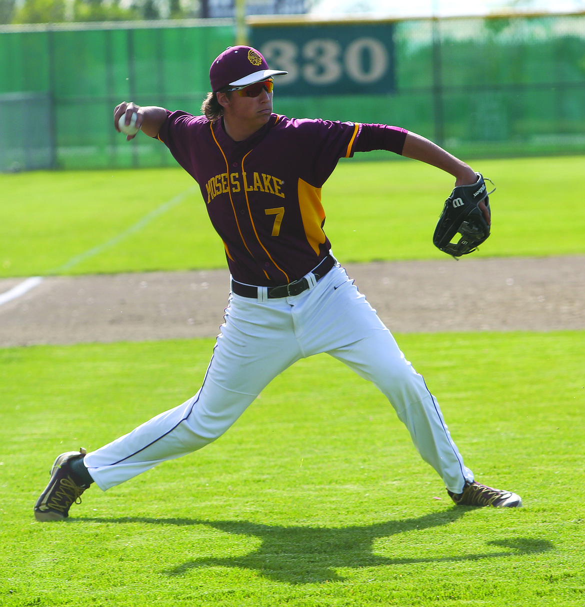 Connor Vanderweyst/Columbia Basin Herald
Moses Lake third baseman Dominic Signorelli fields a bunt and throws to first base for an out against Eastmont.