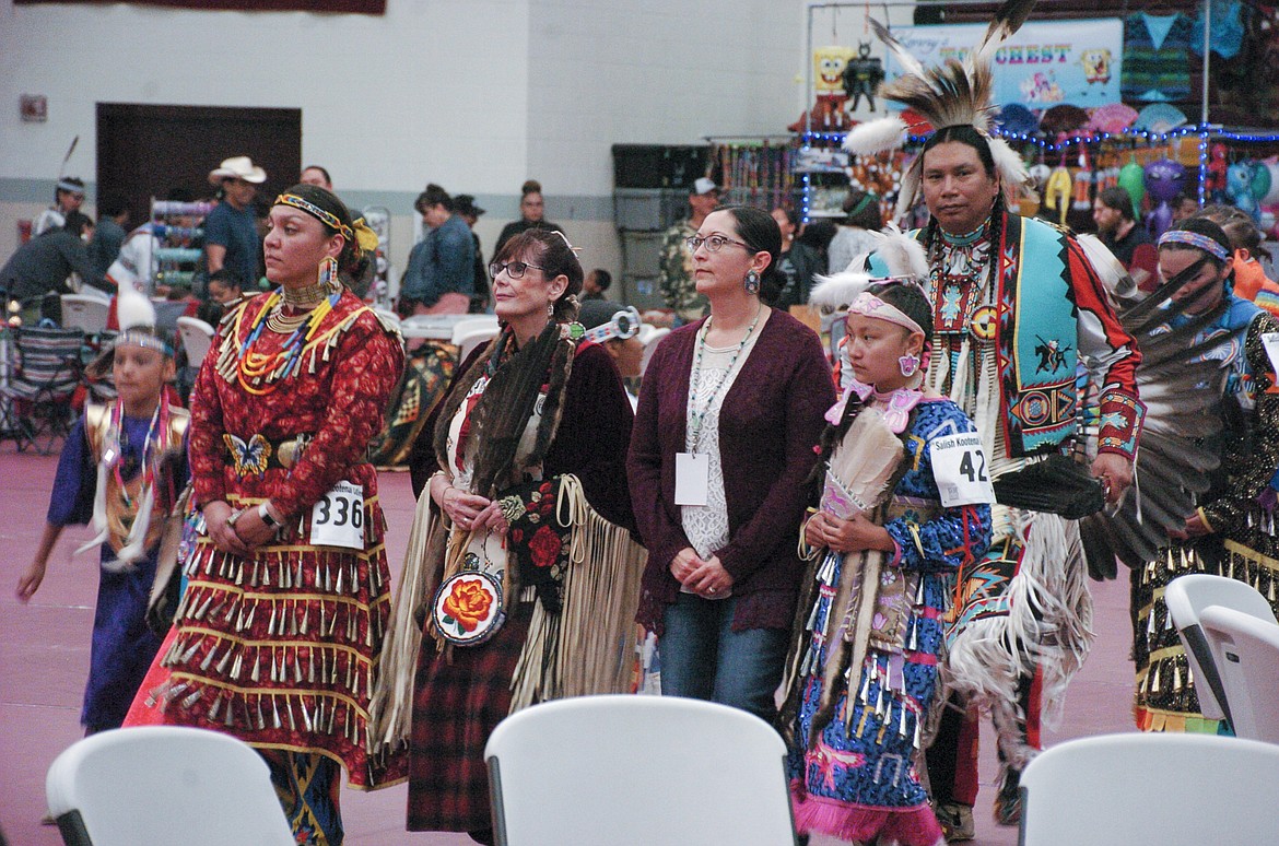 SALISH KOOTENAI College Student Body President ShiNaasha Pete, left, walks alongside SKC President Sandra Boham and fellow participants in the Spring Powwow and Graduate Honoring on Friday. (Brett Berntsen/Lake County Leader)