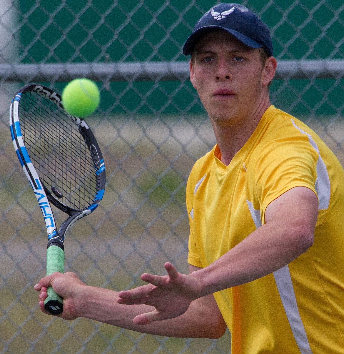 Libby High School's Colin Maloney competes in a tennis divisional in Libby Friday, May 12, 2017. (John Blodgett/The Western News)