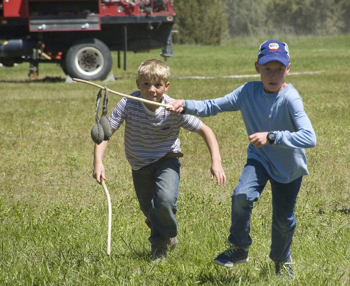 Students from Valley View School&#146;s fourth, fifth and sixth grade class play a traditional Native American game called double ball during the River Honoring last week. (Brett Berntsen/Lake County Leader)