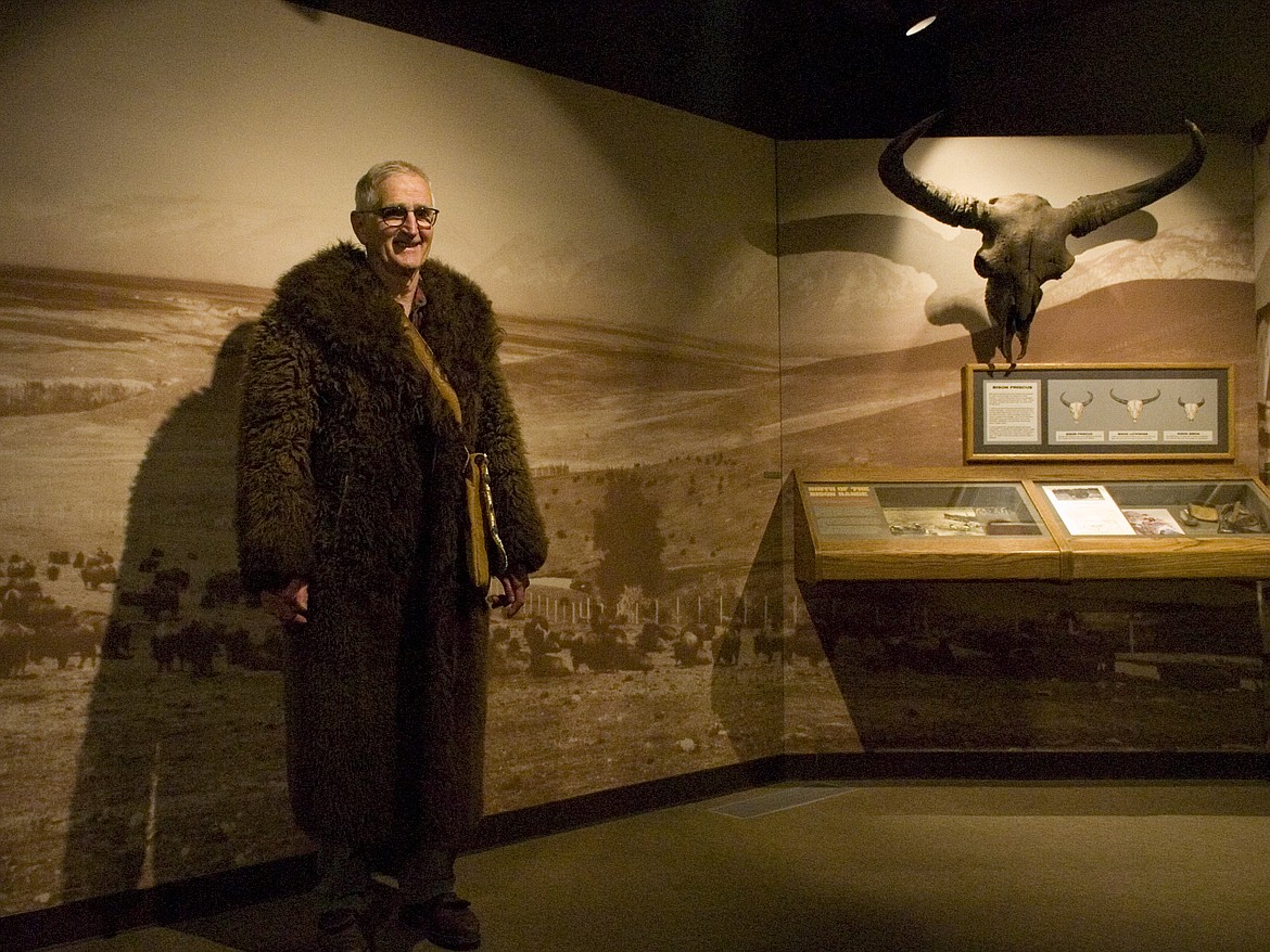 Artist John Sharp posed in a bison rope during an unveiling ceremony for his wood carving which was donated to the National Bison Range.