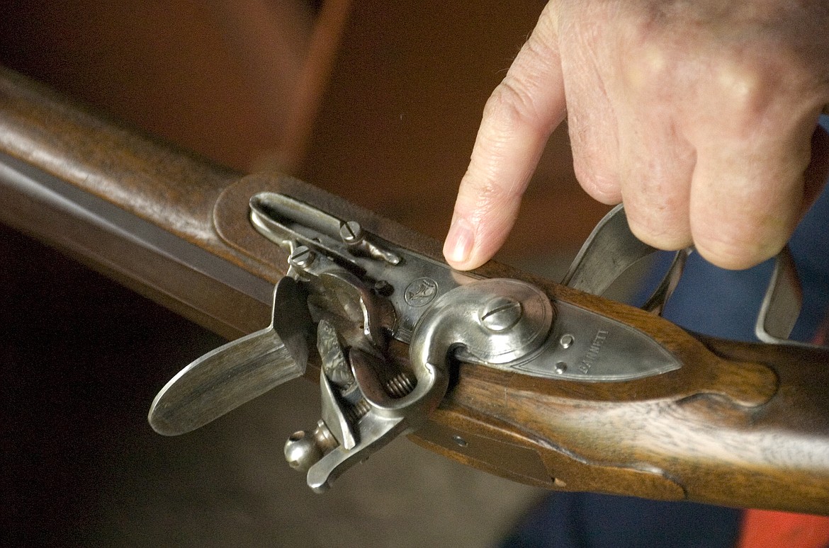 Ted Hoglund of Thompson Falls shows off a flintlock rifle popular on the American frontier during the Fort Connah Spring Rendezvous on Sunday. (Brett Berntsen/Lake County Leader)