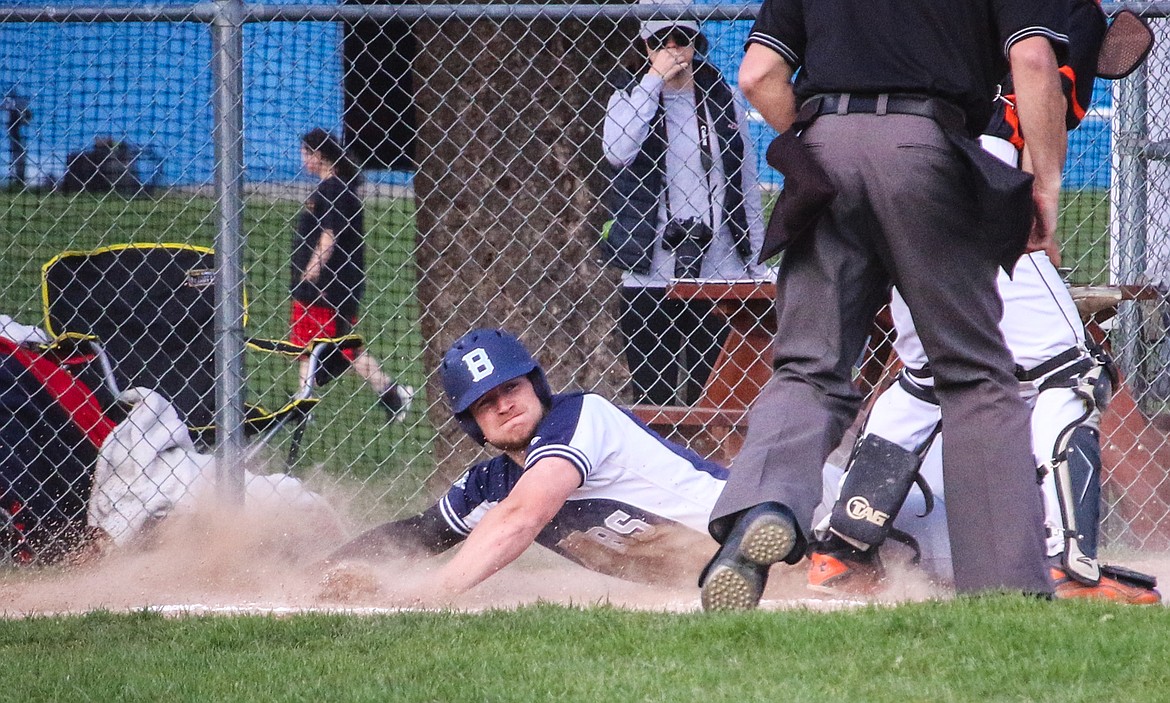 Nick Sabin slides into home.