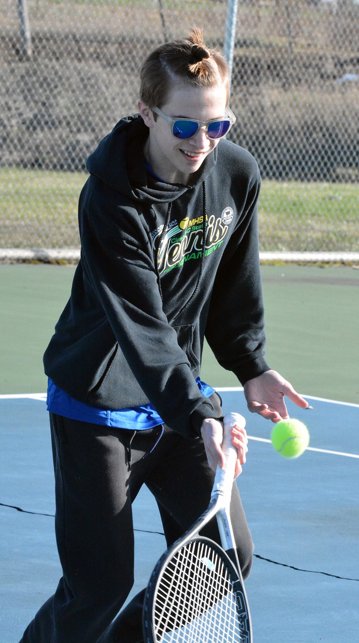 MISSION TENNIS player Warren Castor works on fundamental mechanics at a Mission High School tennis tournament. (Jason Blasco/Lake County Leader)