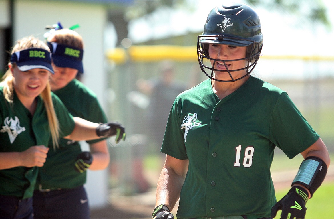 Rodney Harwood/Columbia Basin HeraldBig Bend freshman Savajja Hughes is contradulated after hitting a three-run home run in the fifth inning of first game Wednesday against North Idaho College.