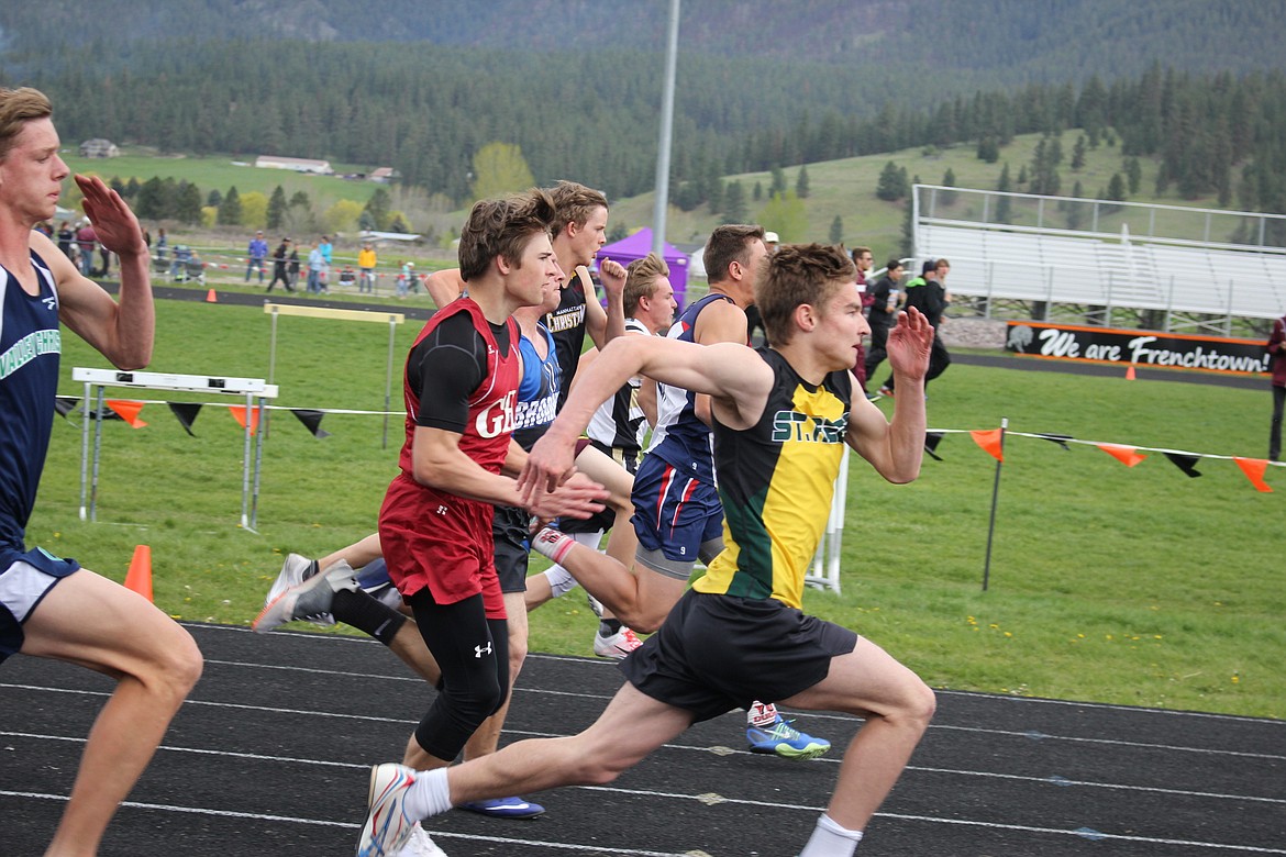 St. Regis Ian Farris tears up the track during the Seeley-Swan Kim Haines Memorial Track Meet in Frenchtown on Saturday. (Kathleen Woodford/Mineral Independent).