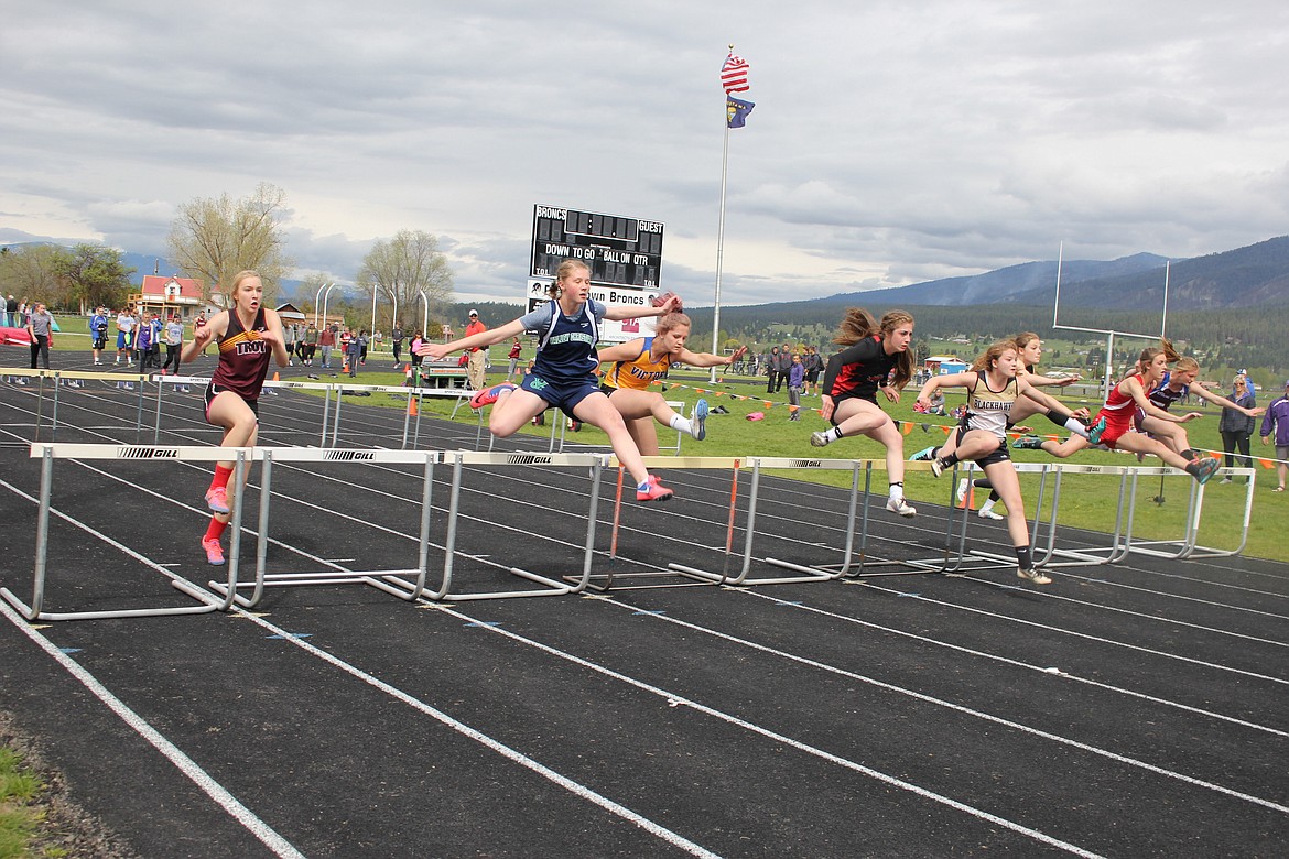 Clark Fork&#146;s Emmah Baughman (far right) takes to the hurdles during the Seeley-Swan track meet on Saturday in Frenchtown. (Kathleen Woodford/Mineral Independent).