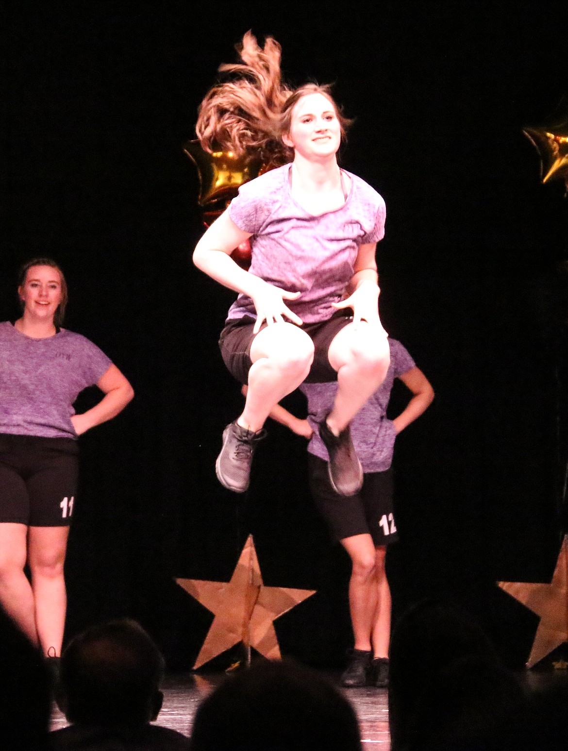 Photo by MANDI BATEMAN
The winner of the 2017-2018 DYW program leaps for the stars during the fitness routine.