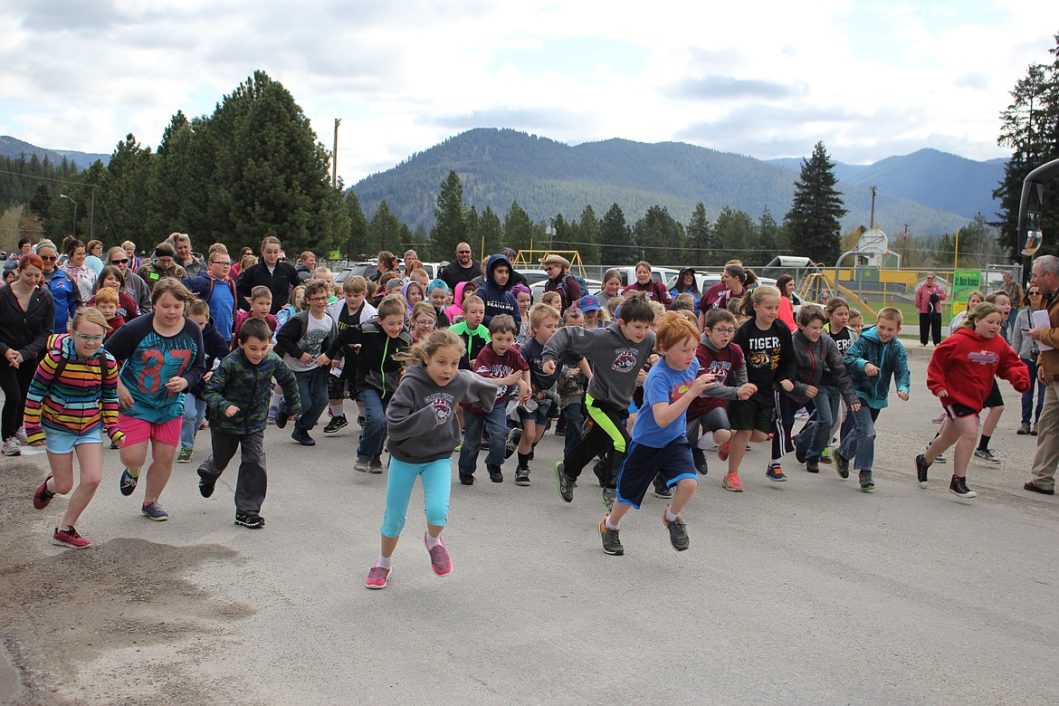 Around 350 kids from all three Mineral County schools participated in the annual Mineral County Fun Run held in St. Regis on May 2. Here Kindergarten through fourth graders start their 1-mile race. (Kathleen Woodford/Mineral Independent).