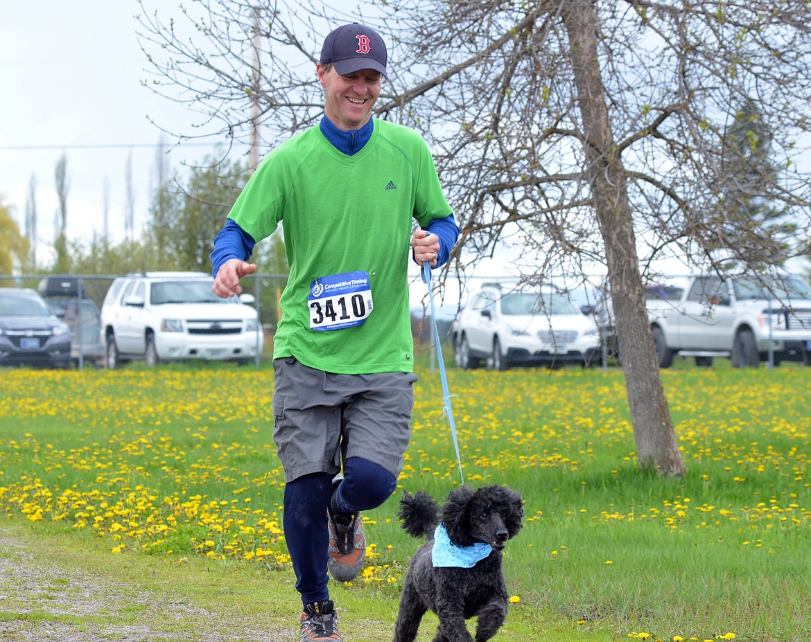 Runners and their dogs competed in the 8th annual WAG race Sunday morning at the Whitefish Hugh Rogers WAG dog park. (Heidi Desch/Whitefish Pilot)