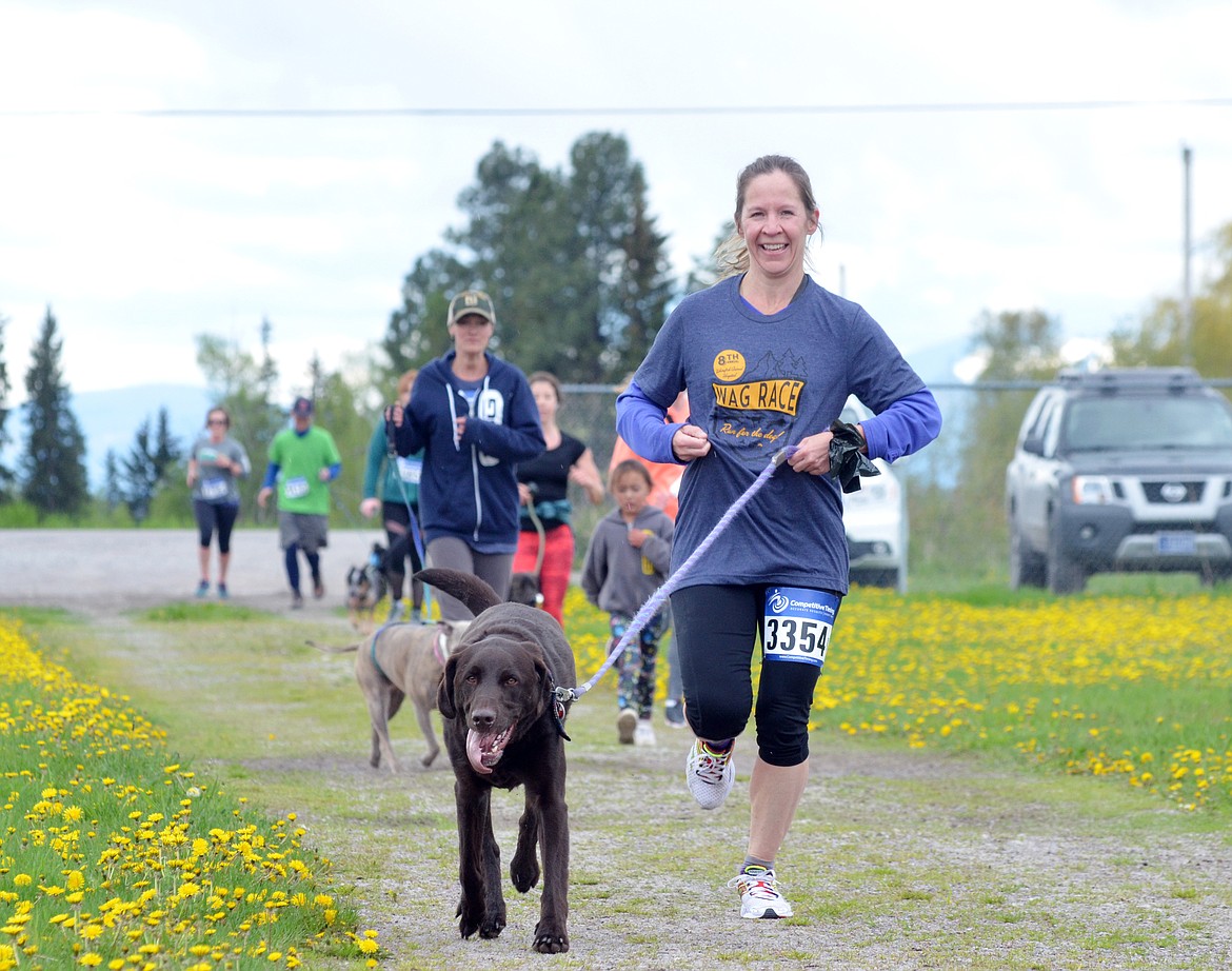 Runners and their dogs competed in the 8th annual WAG race Sunday morning at the Whitefish Hugh Rogers WAG dog park. (Heidi Desch/Whitefish Pilot)