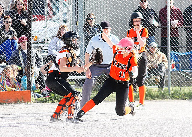 LINDSEY LAWS slides into home to score for the Trotters. (Photos courtesy of Jessica Peterson)