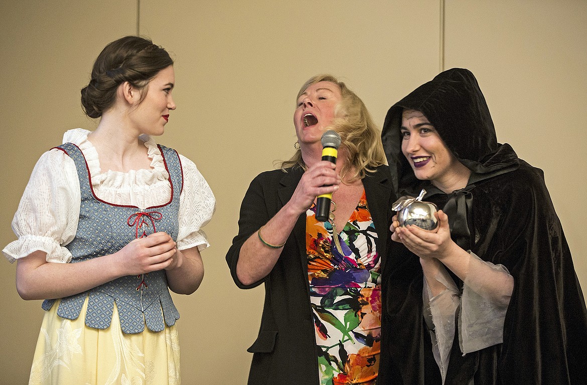 LISA JAMES/Press
Chloe Turnbull, as Snow White, left, and Elaine DeJong, as the Evil Queen, right, flank Marilee Wallace during Tuesday&#146;s Upbeat Breakfast.