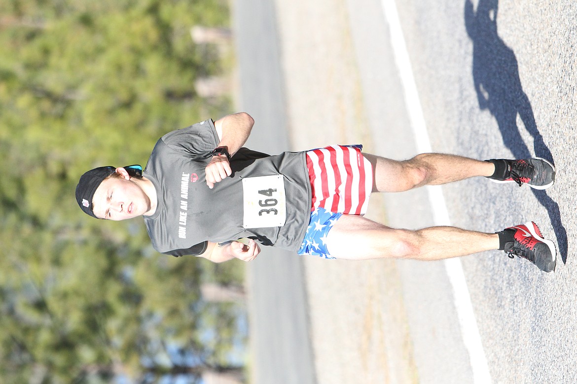 JASON ELLIOTT/Press
Post Falls High product Dylan Schilling prepares to make the turn at Higgens Point in the 40th annual Coeur d&#146;Alene Marathon on Sunday. Schilling finished fifth in the men&#146;s marathon.