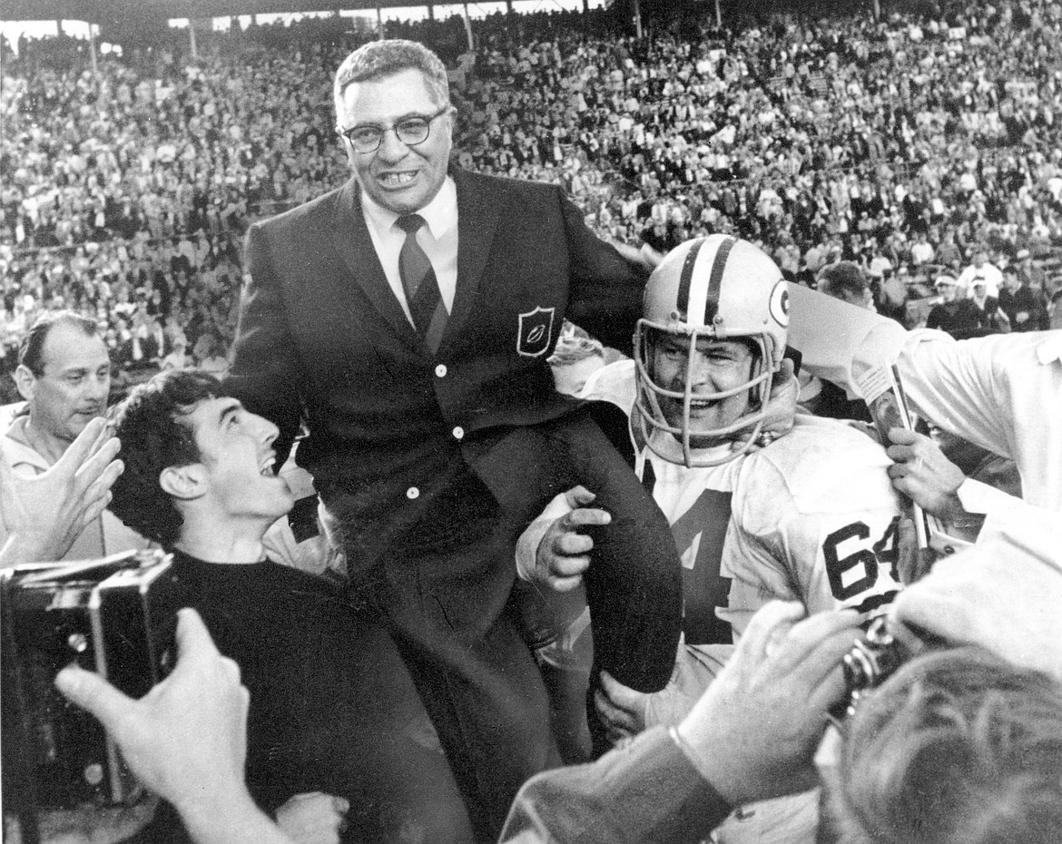 Associated Press
Jerry Kramer (64) helps carry Green Bay coach Vince Lombardi off the field after the Packers beat the Oakland Raiders in Super Bowl II in Miami, Fla., on Jan. 14, 1968.