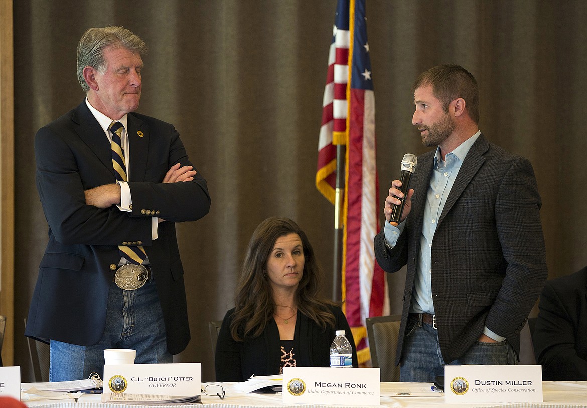 LISA JAMES/Press
Gov. Butch Otter, left, and Megan Ronk from the Idaho Department of Commerce listen as Dustin Miller from the Office of Species Conservation discusses the balance of endangered species and economic growth after a resident questioned the dangers of over-regulating &#147;like in California.&#148; Otter and other state officials were in Hayden Lake Thursday to give local residents the chance to have open discussions about government issues and public policy with them as part of the Capital for a Day program.