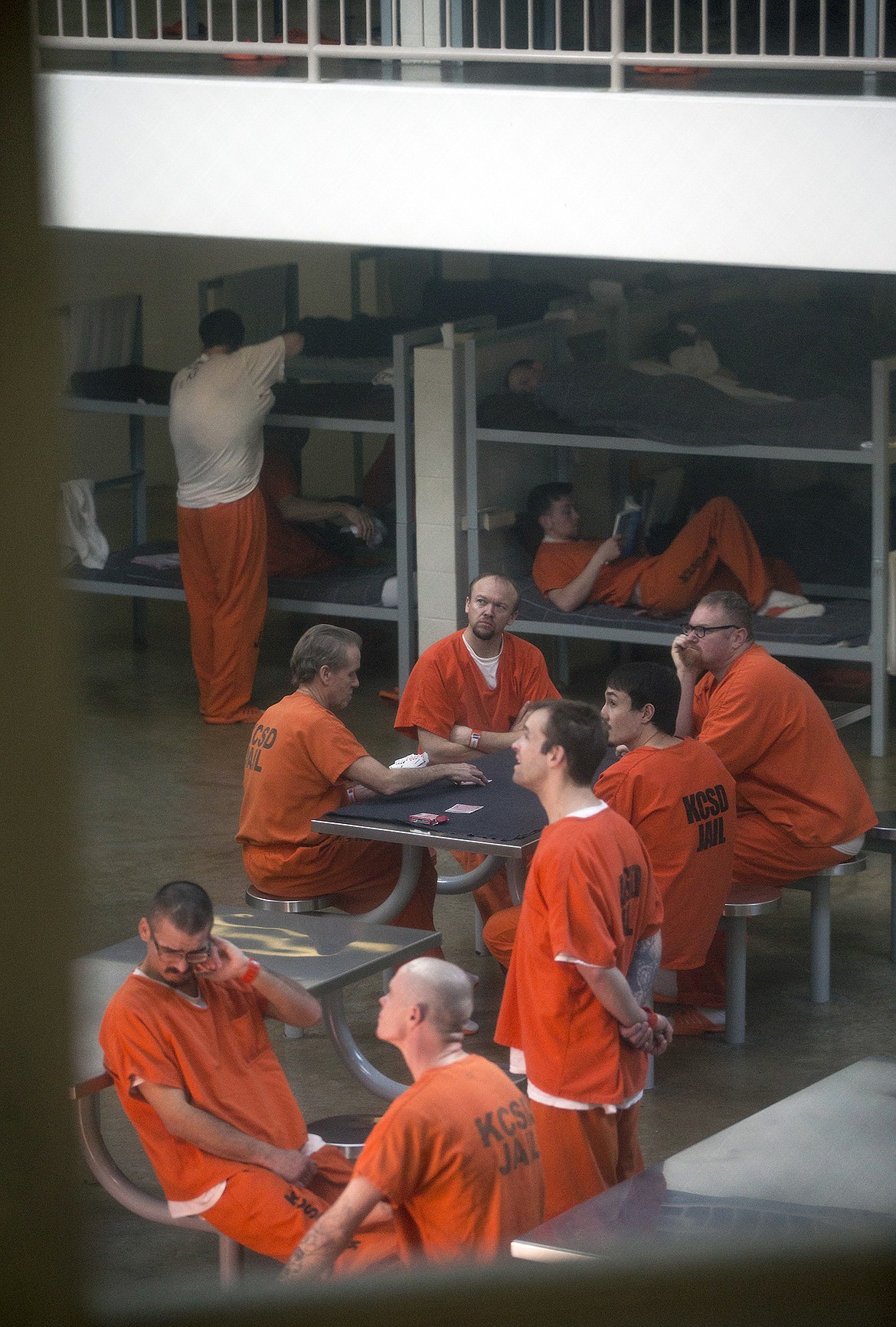 LISA JAMES/PressKootenai County Jail inmates congregate, while some read in their bunks, on April 3. The jail has been at maximum capacity in 2017. County commissioners voted Thursday on the budget for a jail expansion project.