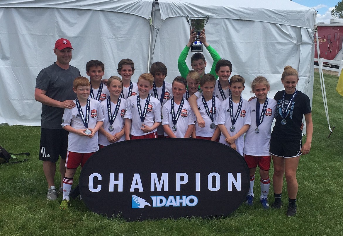 Courtesy photo
The Sting Timbers FC 05 Boys Red soccer team won the gold division at the Director's Cup tournament May 20-21 at the Simplot Sports Complex in Boise. On May 20 the Sting beat the Boise Nationals Timber - White 3-2. Chris Mongan and Cooper Prohaska each had goals, and Landon Lee had two assists. That afternoon, the Sting lost 3-2 to the Idaho Rush - Blue. Ashton Ukich and Caden Thompson each scored for the Sting. On May 21 the Sting played the Boise Nationals Timber - Blue to a scoreless tie. In the championship game, the Sting beat the Idaho Rush - Blue 1-0. Miles Taylor had 10 saves in posting the shutout in goal. In the front row from left are Gavin Schoener, Landon Sternberg, Caden Thompson, Nate Wyatt, Chris Mongan, Landon Lee, Trenton Anderson and assistant coach Chloe Teets; middle, Blaine Leonard; and back row from left, head coach Mike Thompson, Cooper Prohaska, Jacob Ukich, Luke Orozco, Miles Taylor and Ashton Ukich.