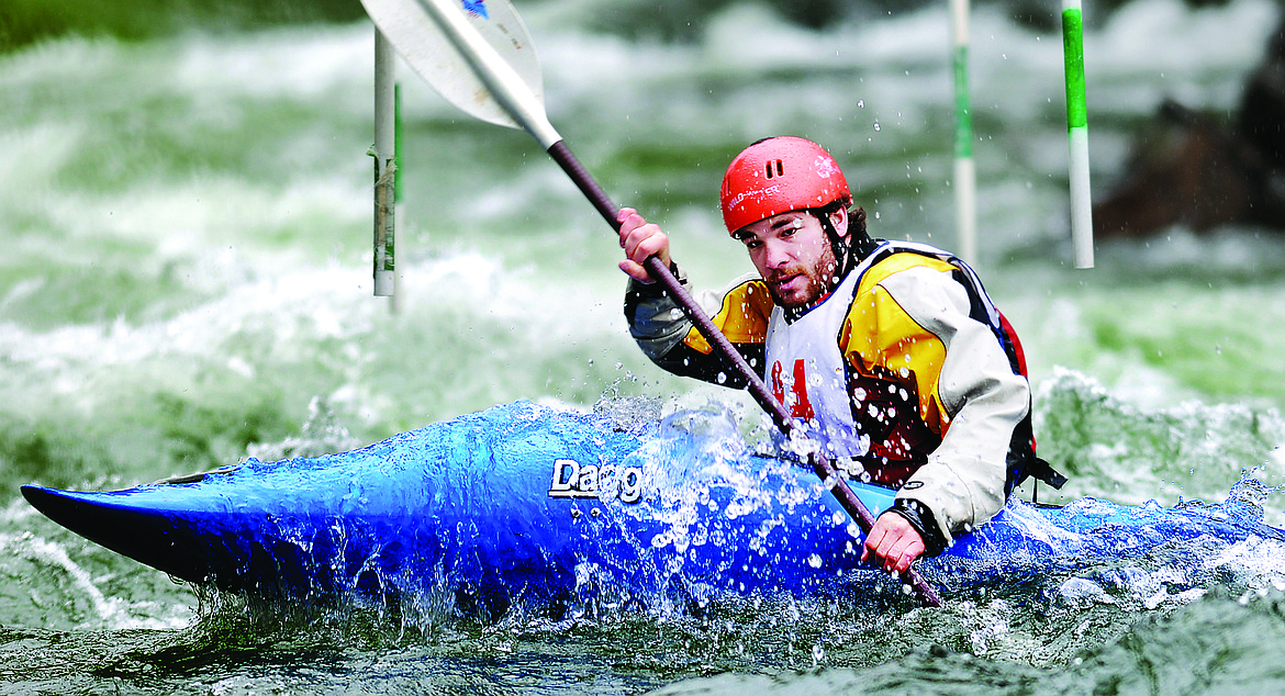 DREW HOLLINGER, of Bigfork comes through two gates on his first run through the beginner slalom at the 2010 Bigfork Whitewater Festival. (Brenda Ahearn/Daily Inter Lake, file)