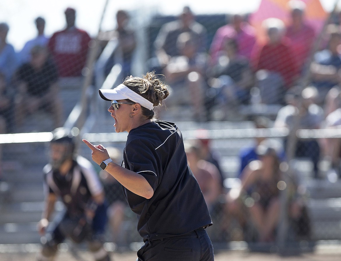LISA JAMES/PressEagle coach Nicole Rollins celebrates the first home run of the final 5A State Championship game against Lake City during the 5th inning at Coeur D'Alene High School on Sunday.