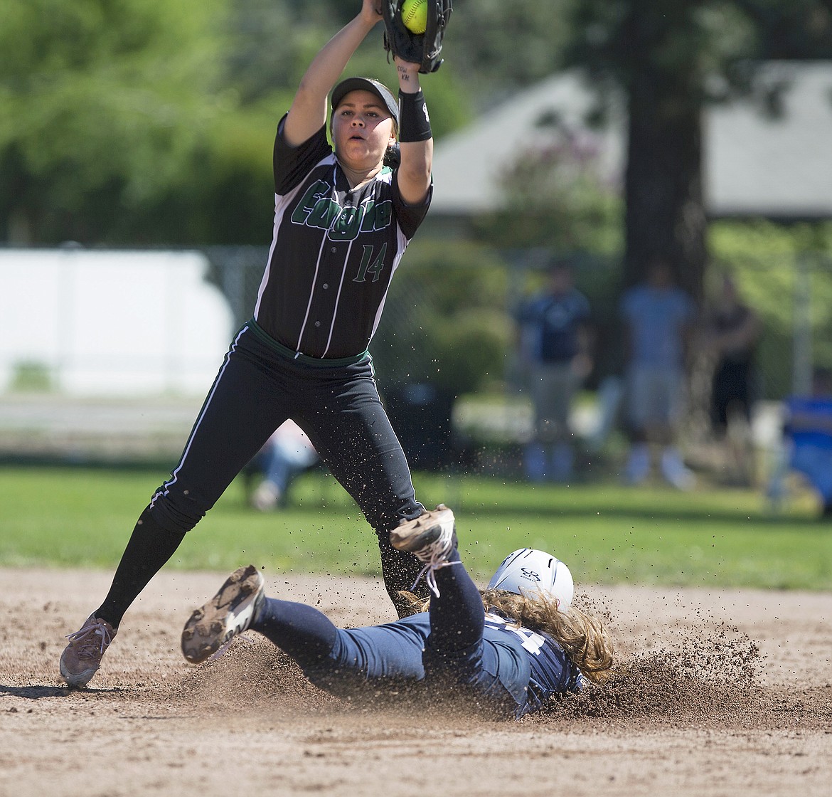 LISA JAMES/PressHaley Loffer of Lake City slides into 2nd as Kelly Kukla of Eagle catches the pass during the 5th inning of their first game of the 5A State Championship at Coeur D'Alene High School on Sunday.