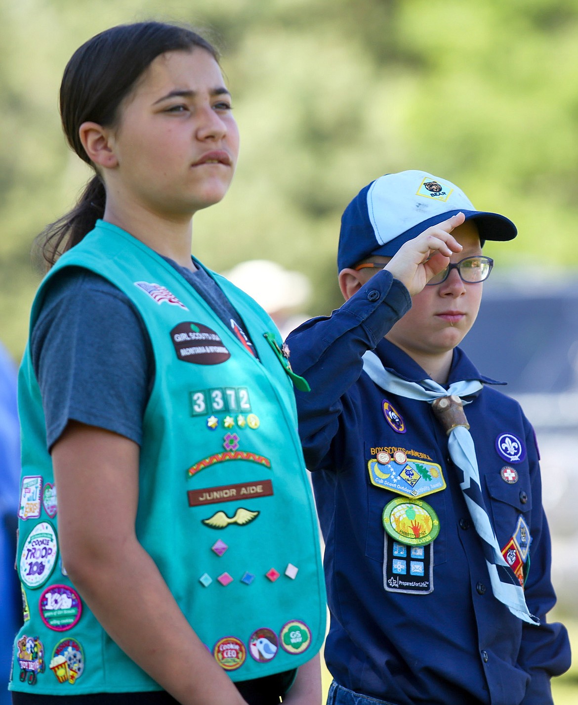 Hannah Guerra, left, and Kale Hall participate in a Memorial Day ceremony at Libby Cemetery Monday, May 29, 2017. (John Blodgett/The Western News)