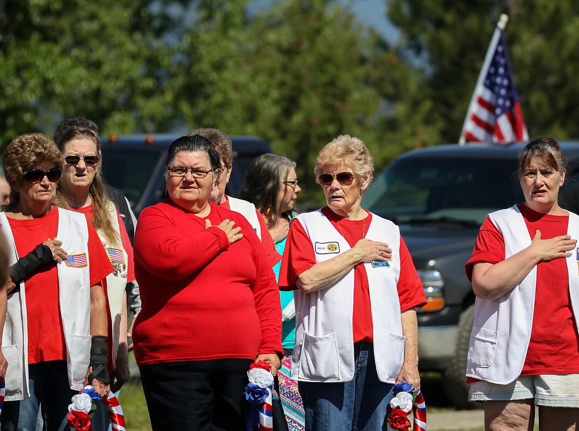 The American Legion Auxiliary salutes the flag during a Memorial Day ceremony at Libby Cemetery Monday, May 29, 2017. (John Blodgett/The Western News)