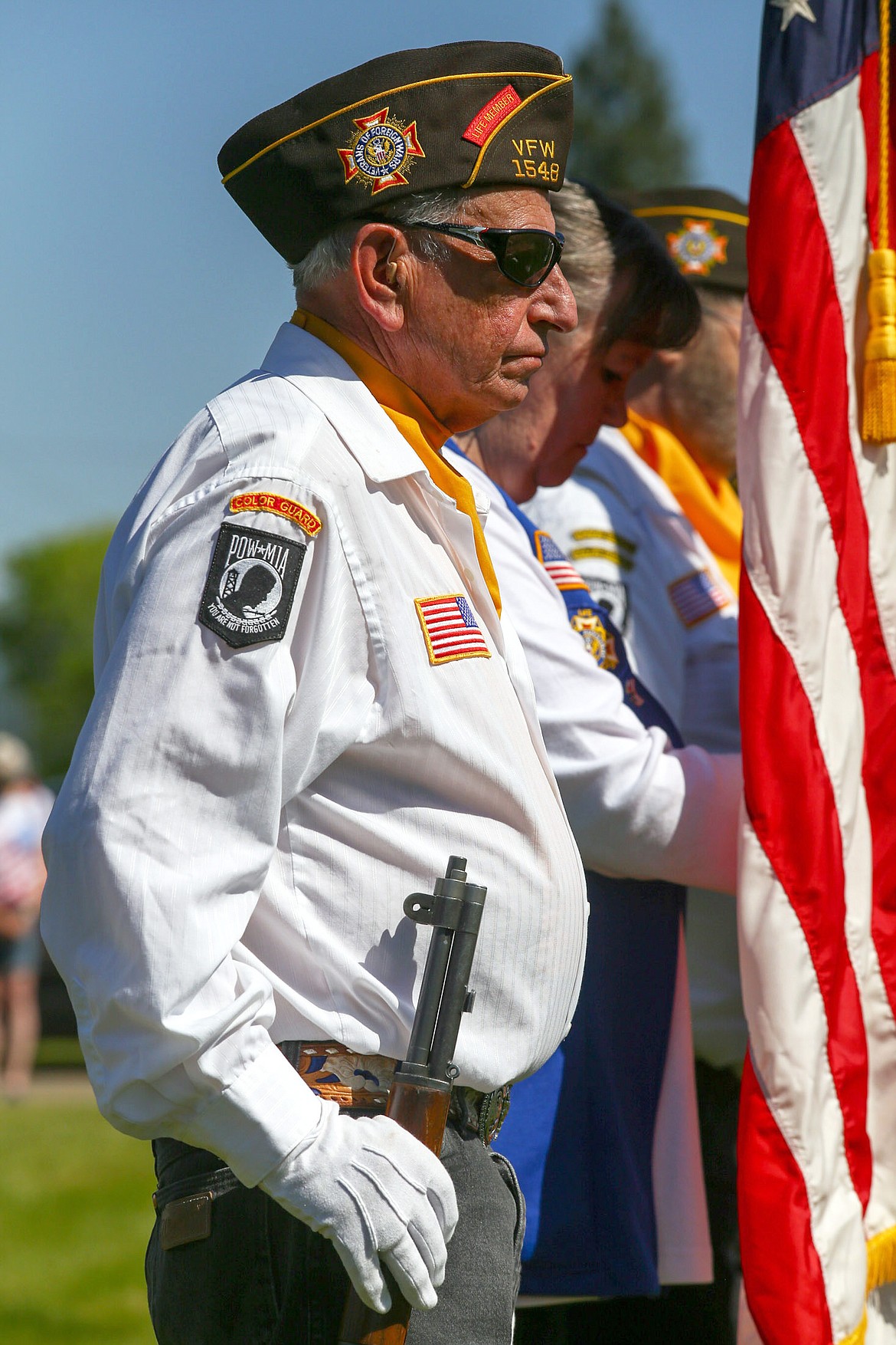 Keith Kenelty of VFW Post No. 1548 stands at attention as part of the color guard during a Memorial Day ceremony at Libby Cemetery Monday, May 29, 2017. (John Blodgett/The Western News)