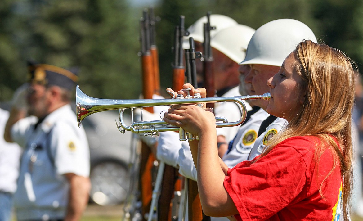 Cerria Swagger plays taps at a Memorial Day ceremony at Libby Cemetery Monday, May 29, 2017. (John Blodgett/The Western News)