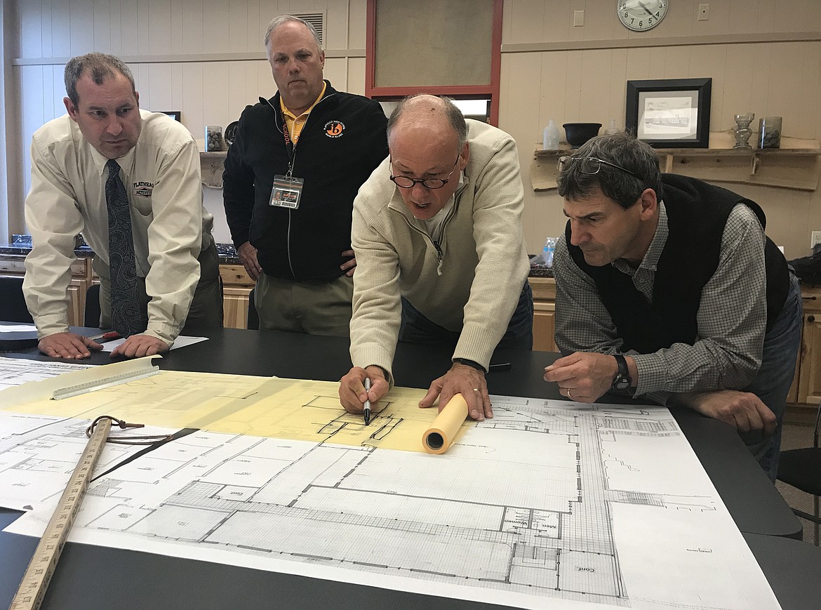 A committee provides input to architects and engineers on renovation and expansion plans for Flathead High School on May 16. Left to right: Flathead Activities Director and Assistant Principal Bryce Wilson, Flathead Assistant Principal Mike Lincoln, L&#146;Heureux Page Werner Principal Architect Steve L&#146;Heureux and Flathead Principal Peter Fusaro. (Hilary Matheson/Daily Inter Lake)