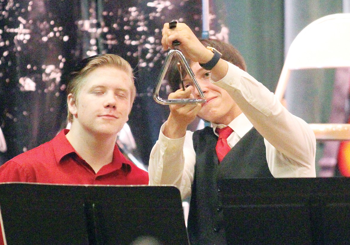 Percussionists Caleb Smith, left, and Ben Gibson perform music from Glee at the All Bands Pop Concert.