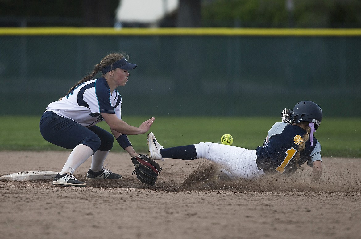 LISA JAMES/Press
Lexi Knauss of Meridian slides safely into 2nd before Haley Loffer of Lake City loses control of the ball during their first of the 5A State Championship games at Coeur D&#146;Alene High School on Friday. Meridian lost 8-2  to Lake City.
