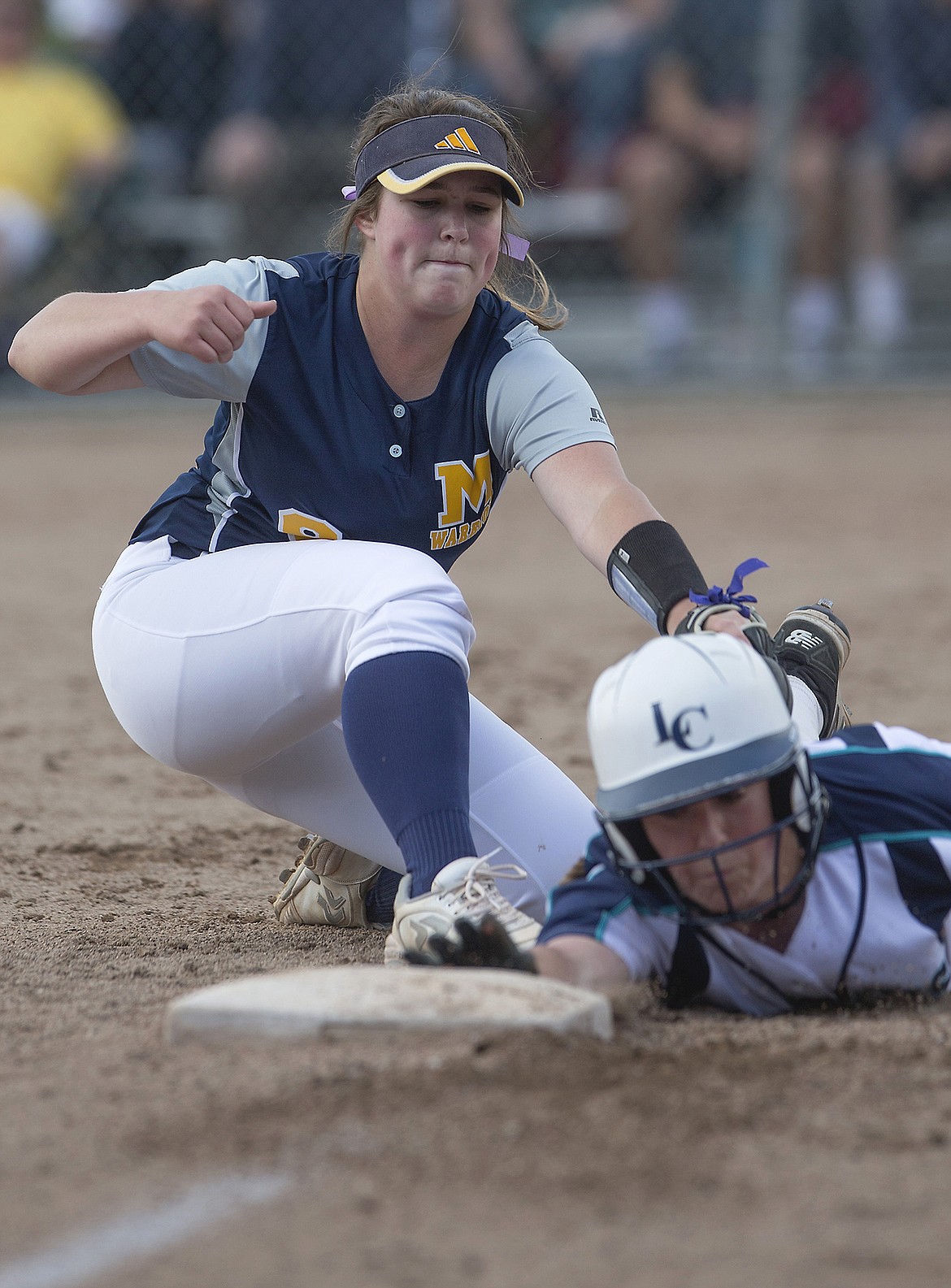 LISA JAMES/Press
Deborah Overby of Meridian tags Haley Loffer of Lake City as she reaches for 3rd after attempting to steal during the 5th inning of the first of the 5A State Championship games at Coeur D&#146;Alene High School on Friday. Meridian lost 8-2  to Lake City.