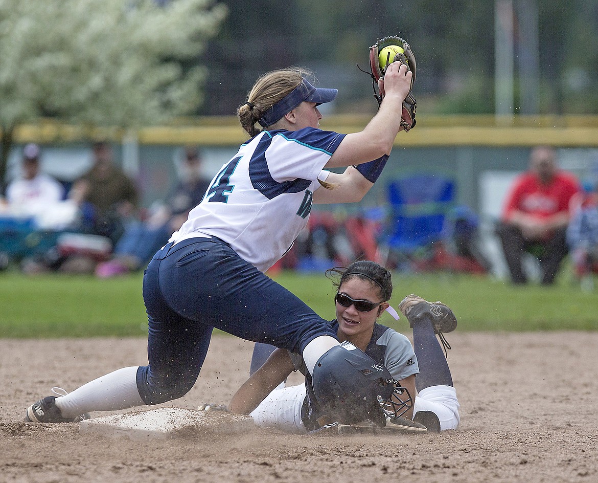 LISA JAMES/Press
Keana Reyes-Burke of Meridian loses her helmet sliding into 2nd as Haley Loffer of Lake City tries to tag her during their first of the 5A State Championship games at Coeur D&#146;Alene High School on Friday. Meridian lost 8-2  to Lake City.