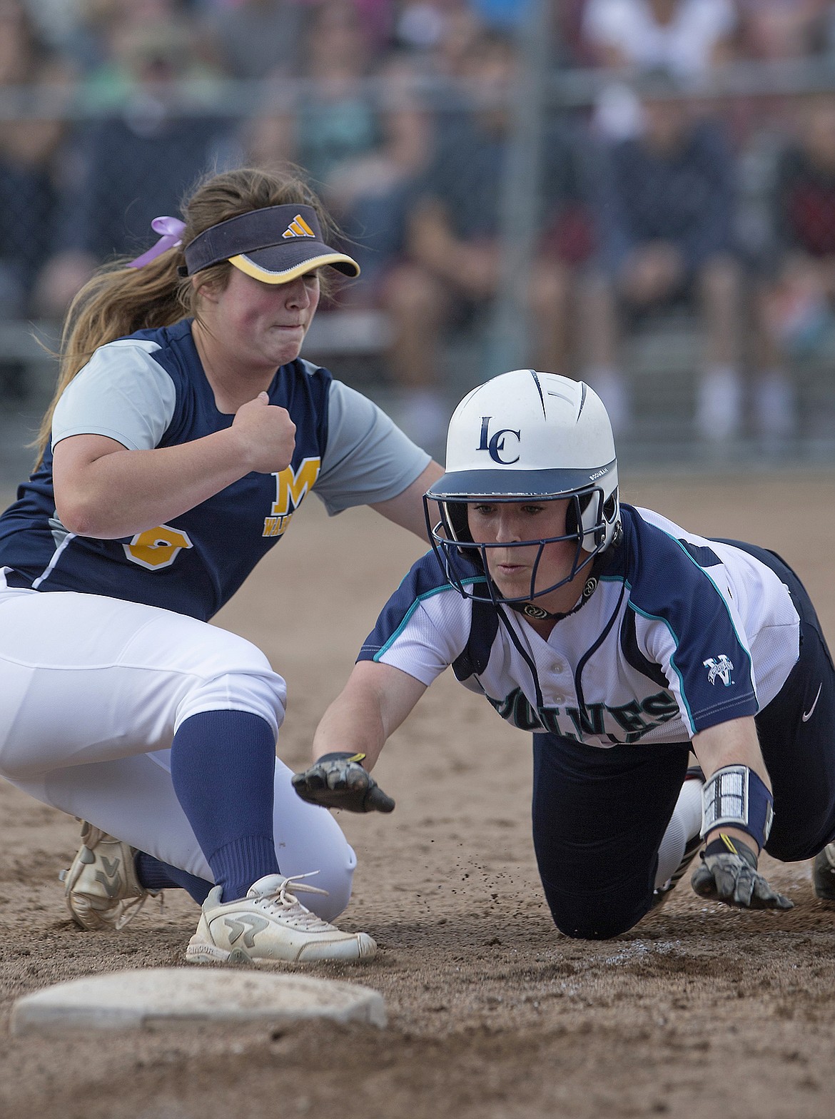 LISA JAMES/Press
Deborah Overby of Meridian tags Haley Loffer of Lake City as she reaches for 3rd after attempting to steal during the 5th inning of the first of the 5A State Championship games at Coeur D&#146;Alene High School on Friday. Meridian lost 8-2  to Lake City.
