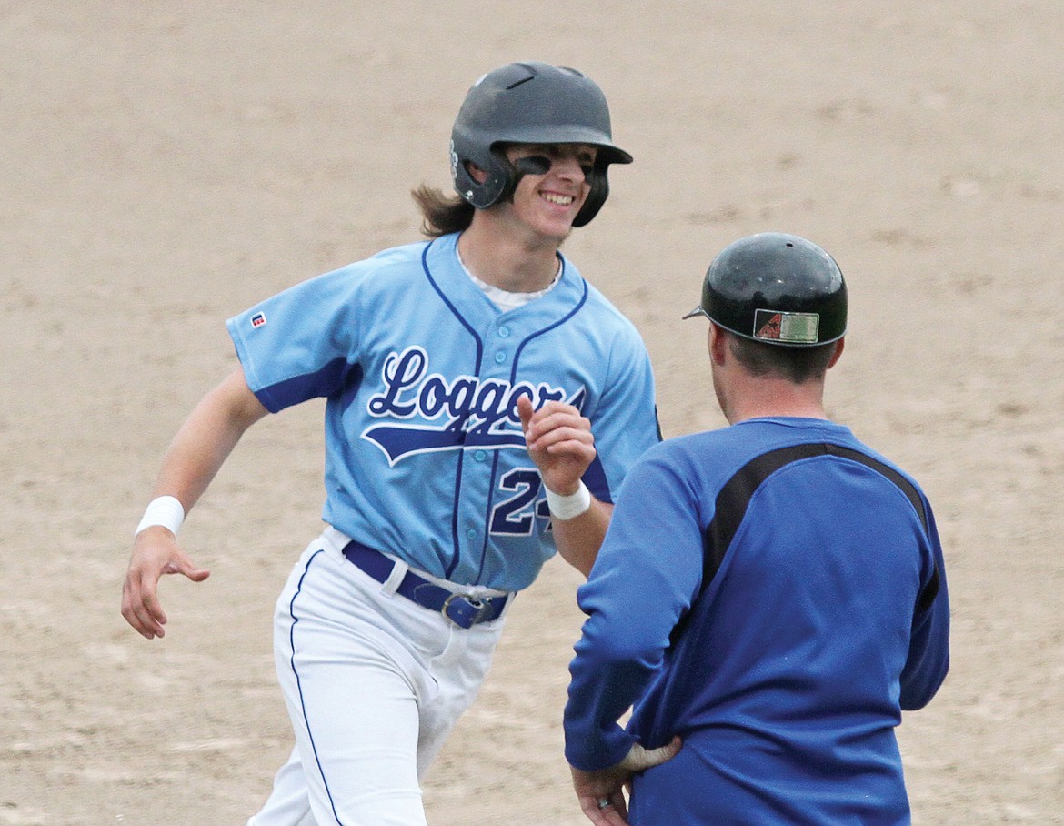 Jesse Dunham is all smiles as he rounds third after his homerun over the left field fence Wednesday vs. the Lakers AA.
