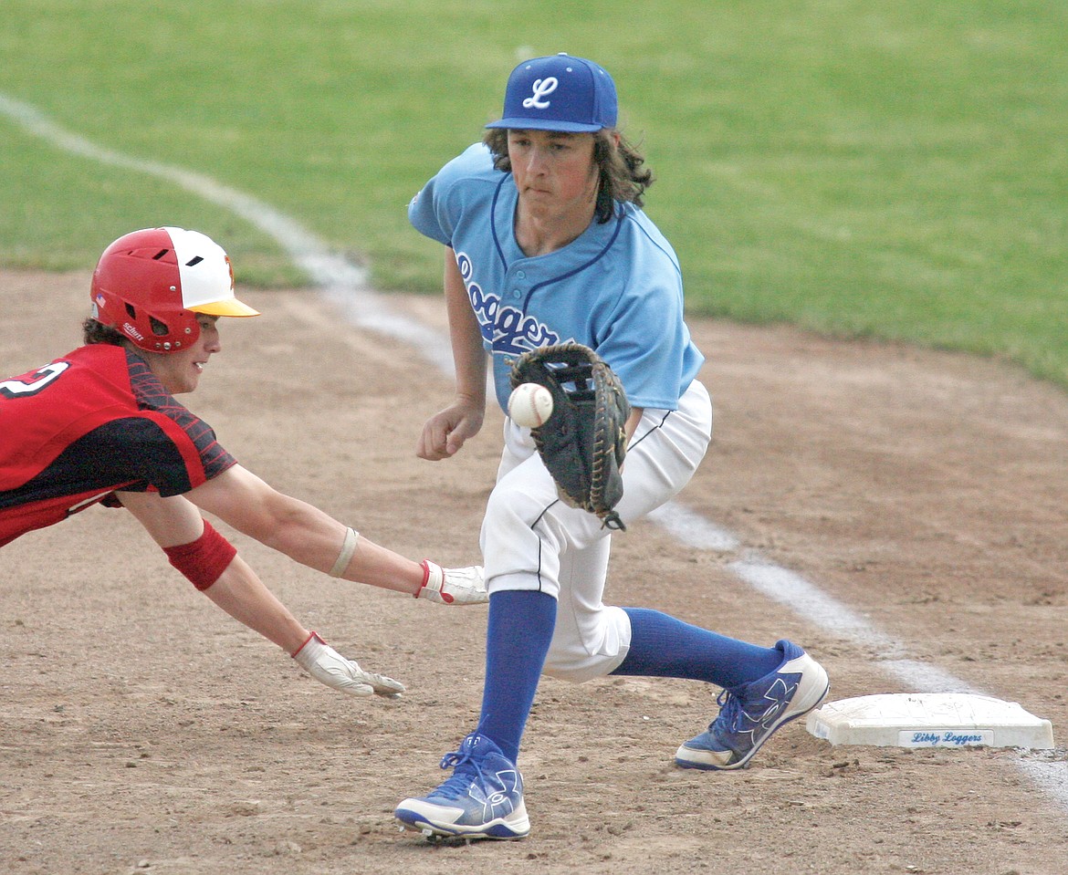 First baseman Shayne Walker checks his runner top of second inning on a throw from pitcher Chris Sabon vs. Kalispell Lakers AA Wednesday evening.