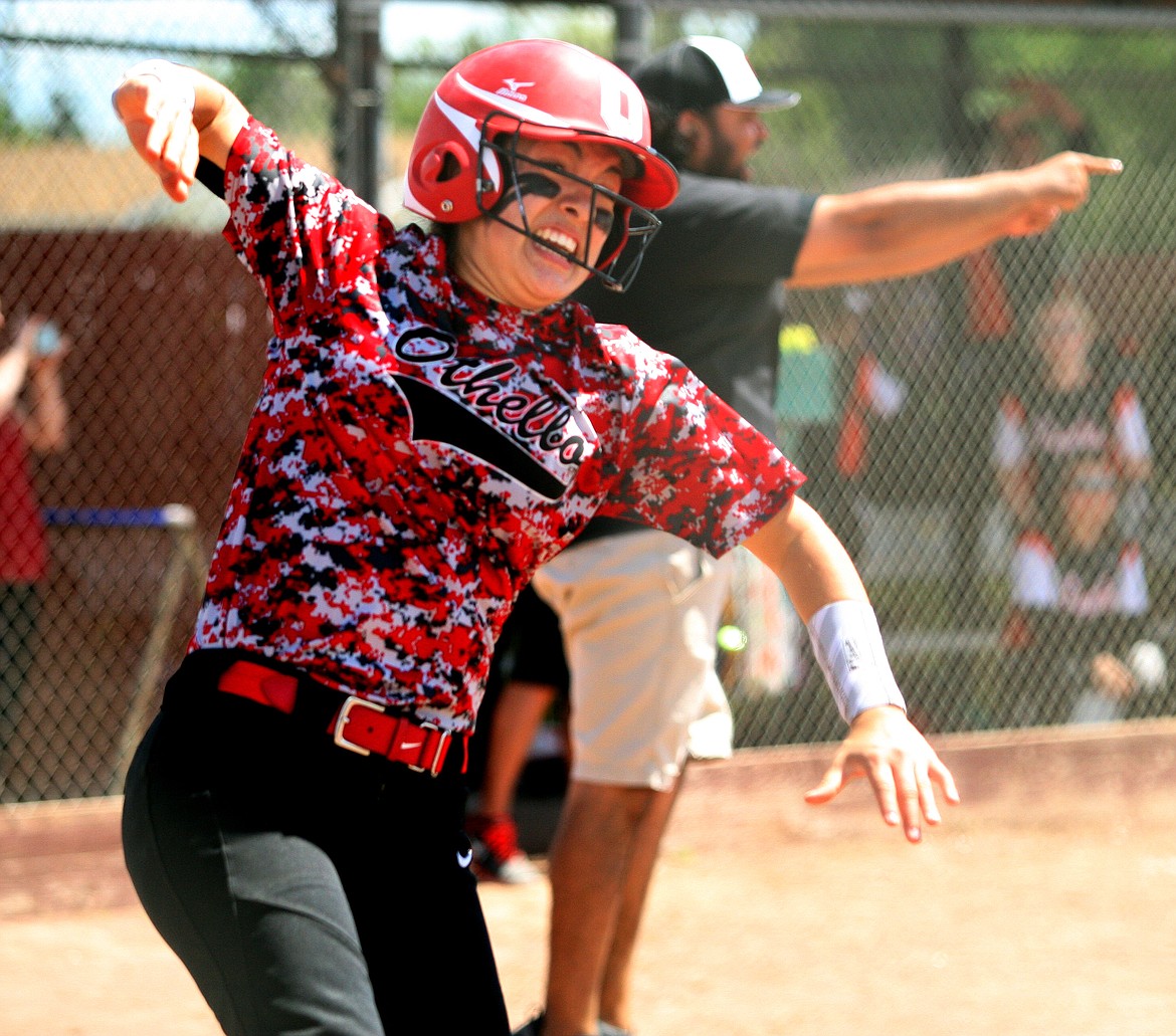 Rodney Harwood/Hagadone Newspaper Group - Othello senior Mariah Deleon reacts after scoring the winning run in Saturday's CWAC/GNL crossover game at Othello. The Huskies came back with three runs in the bottom of the seventh inning to beat West Valley 7-6 to advance to the state tournament.