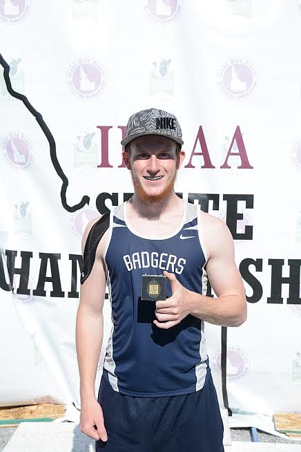 Photo by ROBERT LAVALA
Isaac Lavala wins the 3A state pole vault championship.