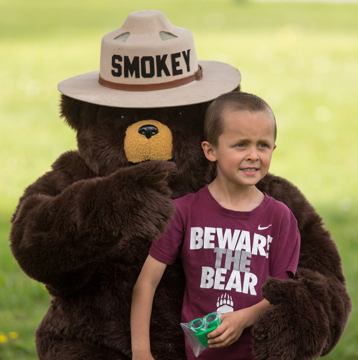 Andrew Duran, 6, of Libby poses with Smokey the Bear at Fireman&#146;s Park Saturday.