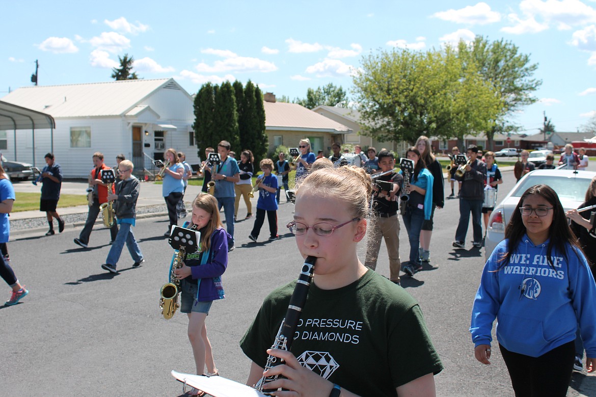 Charles H. Featherstone/Columbia Basin Herald
Members of the Frontier Middle School Marching Band march down Fourth Avenue Friday afternoon.