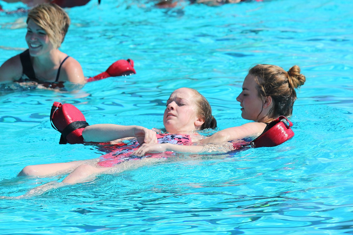 Cheryl Schweizer/Columbia Basin Herald
Lifeguards practice removing an unconscious swimmer in at a training course at the Surf &#145;n Slide water park Friday.