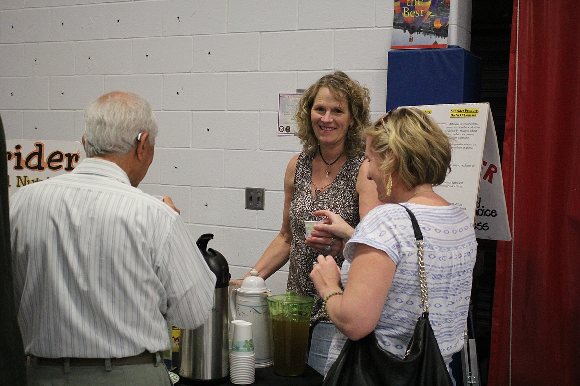 Terry Zylway with Sunrider Whole Food Nutrition supplies samples of healthy Vitashakes to people at the Mineral Community Hospital Health Fair. (Kathleen Woodford/Mineral Independent).