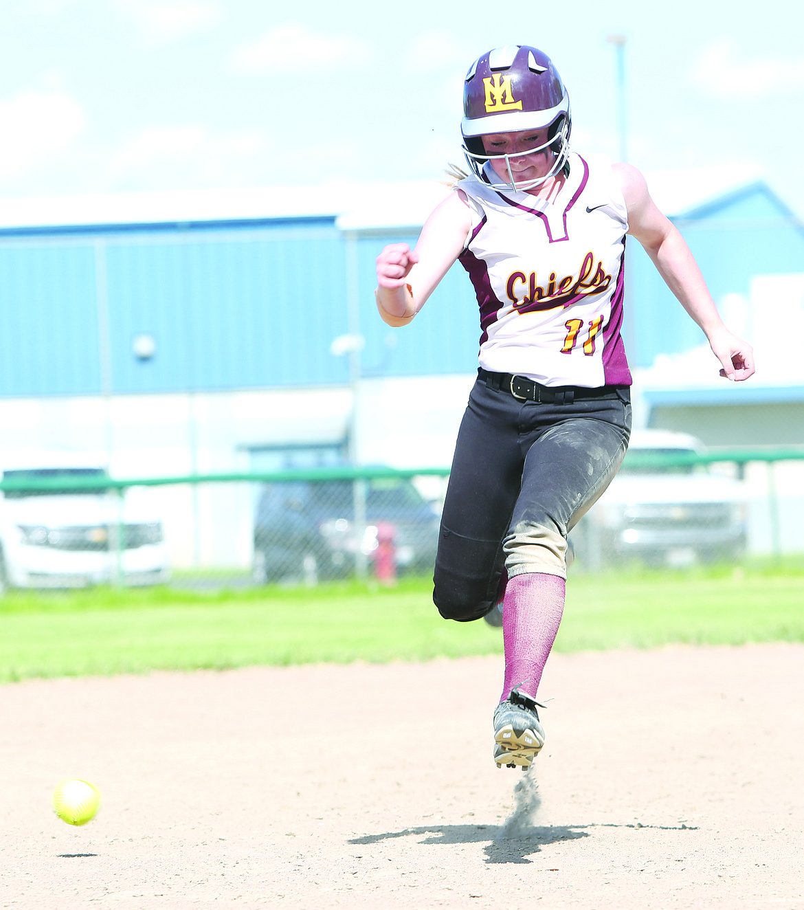 Connor Vanderweyst/Columbia Basin Herald
Michelle Turner hops over the ball on her way to third base.