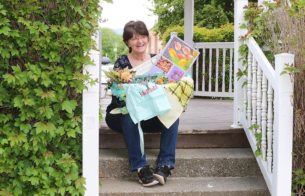 Lori Koubek with her basket of goodies.